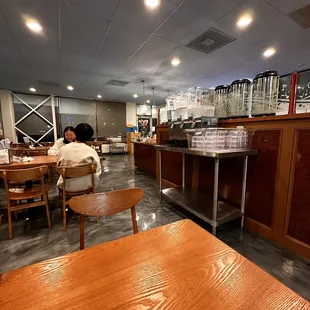a man sitting at a table in a restaurant