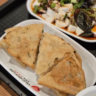 two plates of food on a tray