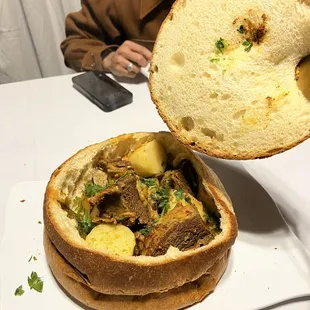 a man taking a bite out of a sandwich