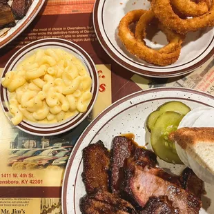 Brisket plate with mac and cheese and onion rings.