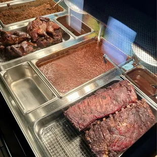 From Top: Chopped Mutton, Whole Chickens, Baked Beans, &amp; Pork Ribs.