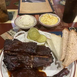 1/4 dark chicken, bbq pork ribs, potato salad, Mac n cheese.
