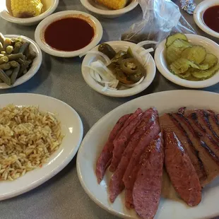 Two meats, green beans, (not so) dirty rice, and hot BBQ sauce.