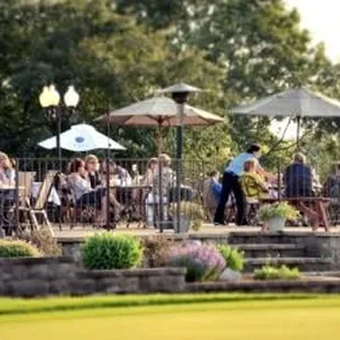 a group of people eating outdoors