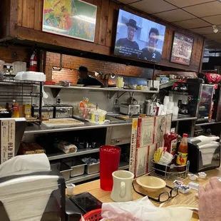 Best place to sit. You can watch them make everything.  Happy to see they serve breakfast until 2 pm.