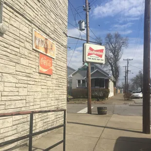 a brick building with a sign on the side of it