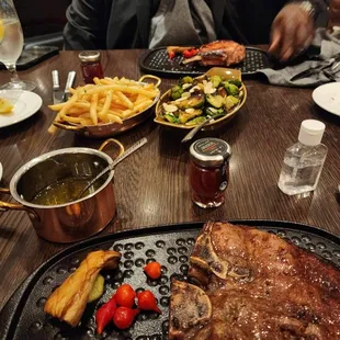 Brussels sprouts, porterhouse at bottom. I had pork chop