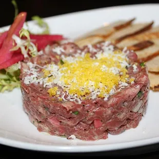 The Hand-Cut Steak Tartare was very good; it was made with prime beef, cured yolk, horseradish &amp; watercress.