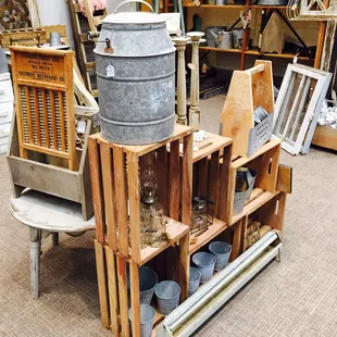 Windows, stained crates and galvanized cans displayed at Ruffles &amp; Rust show at Shawnee Expo center.