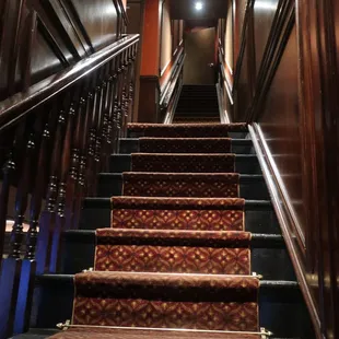 Staircase to upstairs dining room.