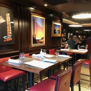 Some decor and tables right by the entrance.