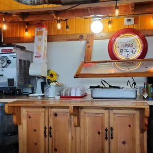 a kitchen with wooden cabinets