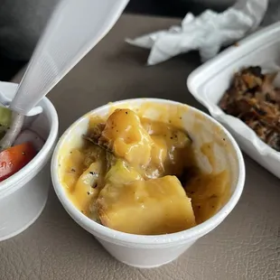 Potatoes not cooked and have water down cheese whiz on top of them