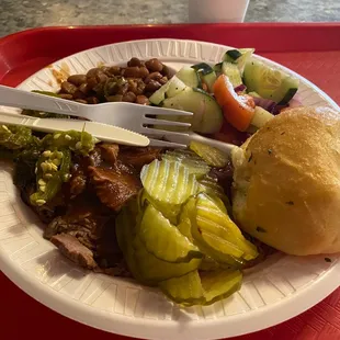 Sliced beef, cucumber salad, spicy pinto beans. Lots of condiments available