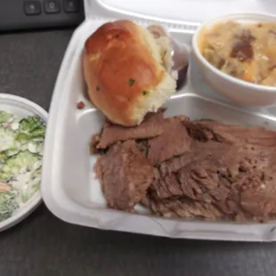 Sliced beef comes with 2 sides and roll, sides are cheesy potato and broccoli salad. Sauce was necessary but also tasty