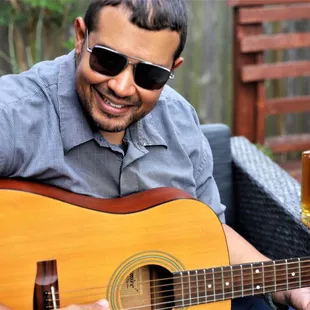 a man playing a guitar