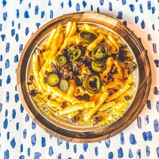 Cheese fries loaded with cheese, cheese, and more cheese + bacon and jalapenos.