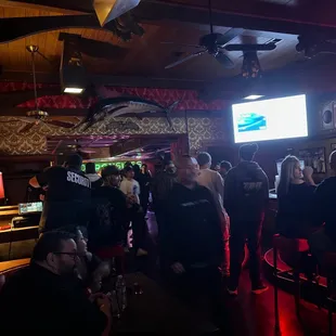 a group of people at a bar