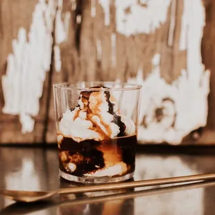 Affogato  Ice cream + shot of espresso topped with whipped cream, mocha + caramel drizzle