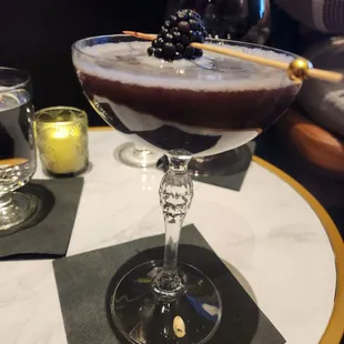 Delicious cocktail!  Vodka, blackberry, and lime