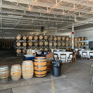barrels and tables in a warehouse