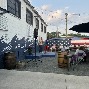 a group of people sitting outside of a building