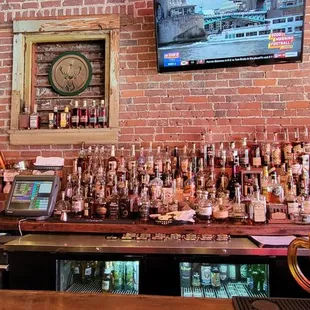 a bar with a brick wall