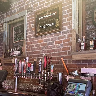 a bar with a brick wall