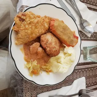 Assortment of eats from the buffet line. Kartoshechka (mash pots), breaded pork cutlet, relish, meetball bread patty, pork with sauce.