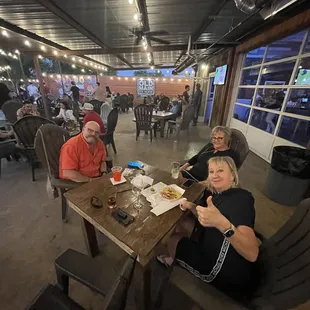 a group of people sitting at a table