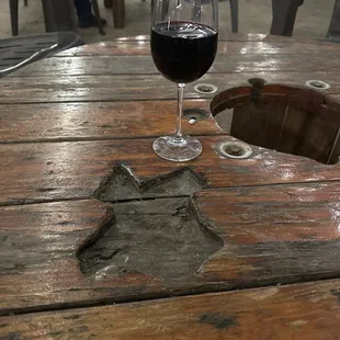 a glass of wine on a table