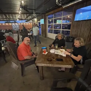 a group of people sitting around a table