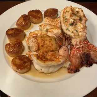 Seafood Feast! Sea scallops, orange roughy, crab cake, lobster tail, and jumbo shrimp.