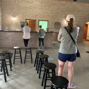 a group of people in a tasting room