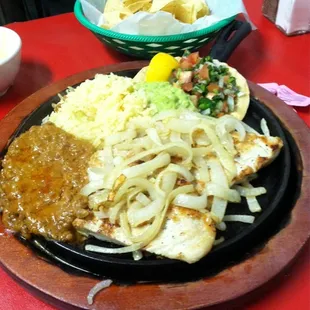 a plate of food on a red table