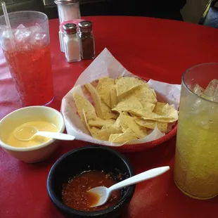 Chips, chile con queso, and salsa. Also pineapple and fruit punch Jarritos drinks.