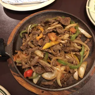 Skillet with fajitas for two