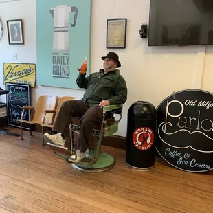 a man sitting in a barber chair