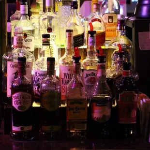 a variety of liquor bottles