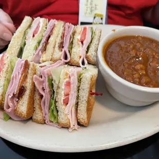 Club sandwich with side of beans