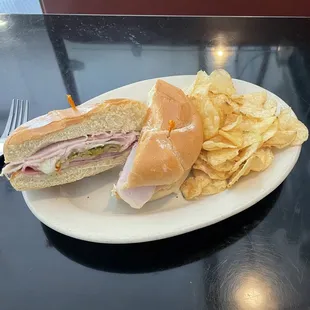Muffaleta sandwich with a side of chips
