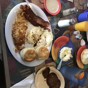 2 eggs over easy, grits, bacon, to die for biscuits and sausage! Under $12