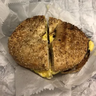 a half eaten bagel sandwich