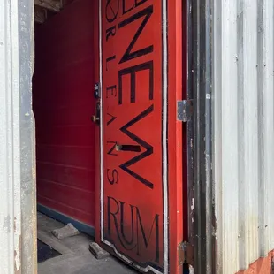 a red door with the word old new orleans rum written on it