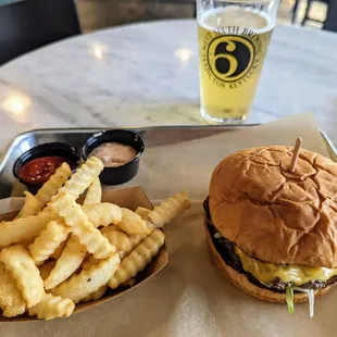 a burger and fries on a tray