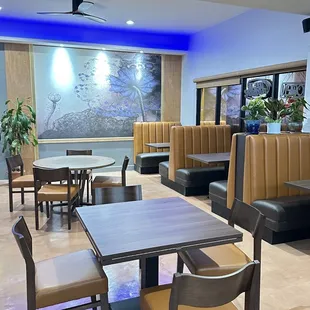 an empty restaurant with tables and chairs