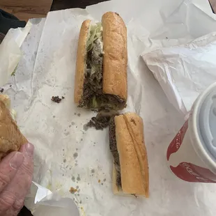 My sandwich below and the one my dad ordered above, massive difference in size and filling- same cost