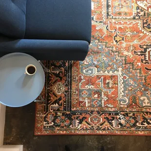 Seating area with couch, rug,  and side table