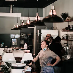 a woman standing at the counter
