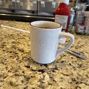 a cup of tea on a counter